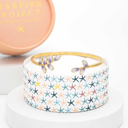 Hope Grows lavender and gold cuff on a Starfish Project round gift box