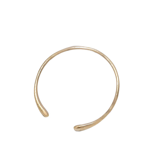Sana hammered brass cuff choker worn on neck showing teardrop end detail
