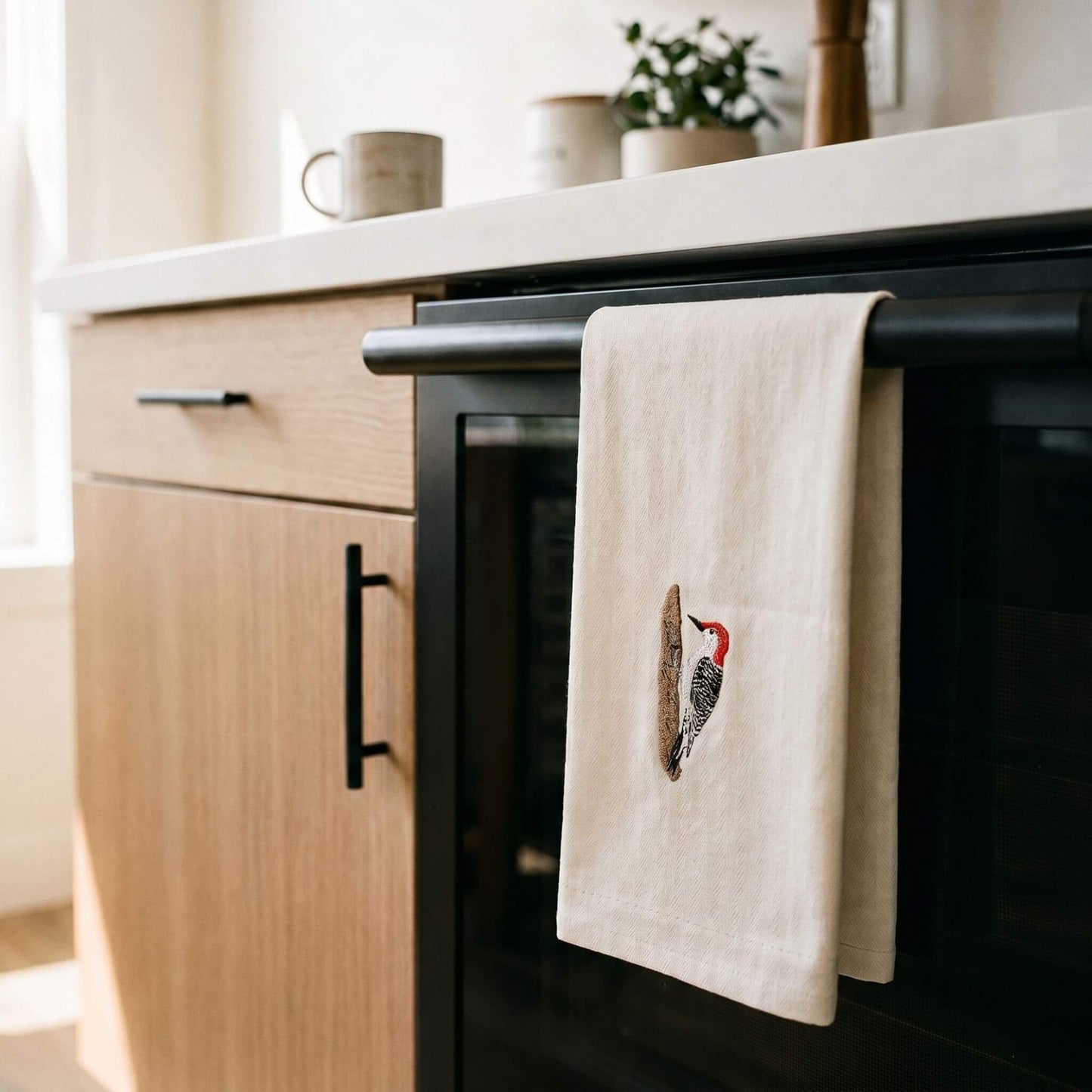Woodpecker bird embroidered cotton tea towel flat lay on white surface #birds_woodpecker