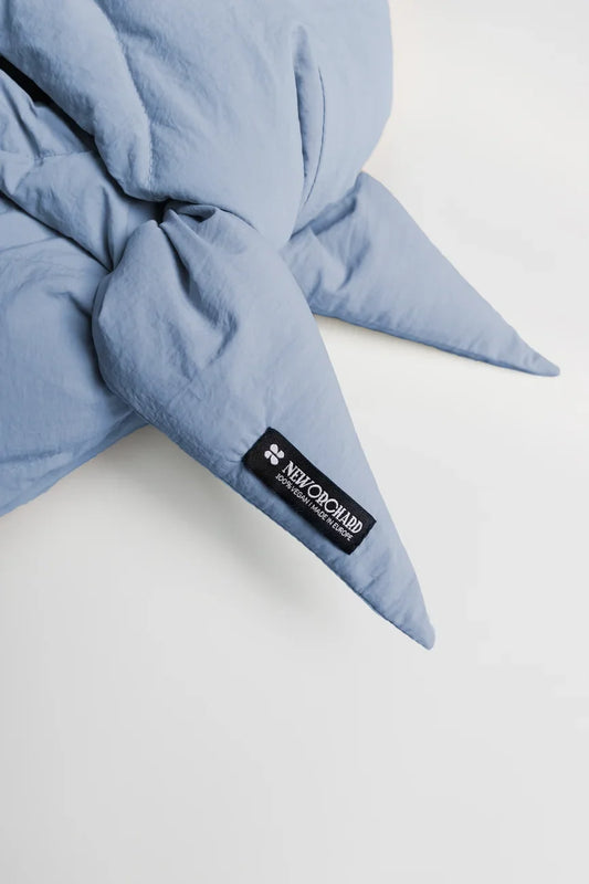 Sky blue vegan capuche made from quilted recycled materials with black logo patch. - The New Orchard - Sky Blue