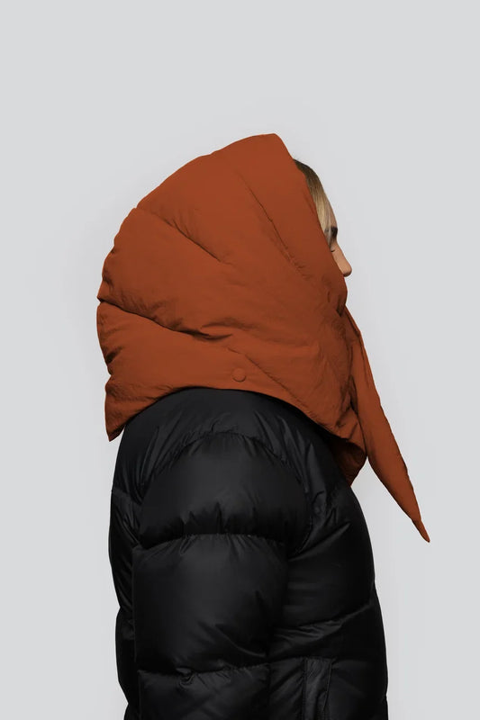 Vegan winter hood in fresh cinnamon color made from recycled materials, worn over black puffer jacket. - The New Orchard - Fresh Cinnamon