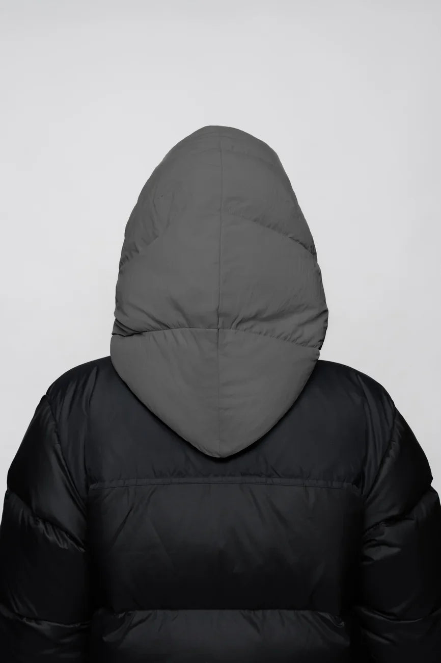 Grey vegan winter capuche with recycled materials, shown from back on black puffer jacket. - The New Orchard - Light Grey