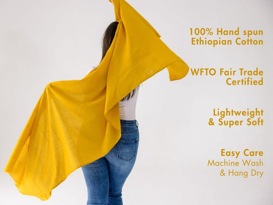 maraki shawl in gold with key features against white background
