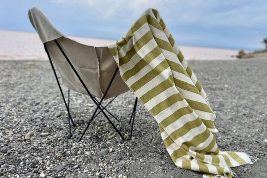 Omo beach towel in moss on camping chair at the beach