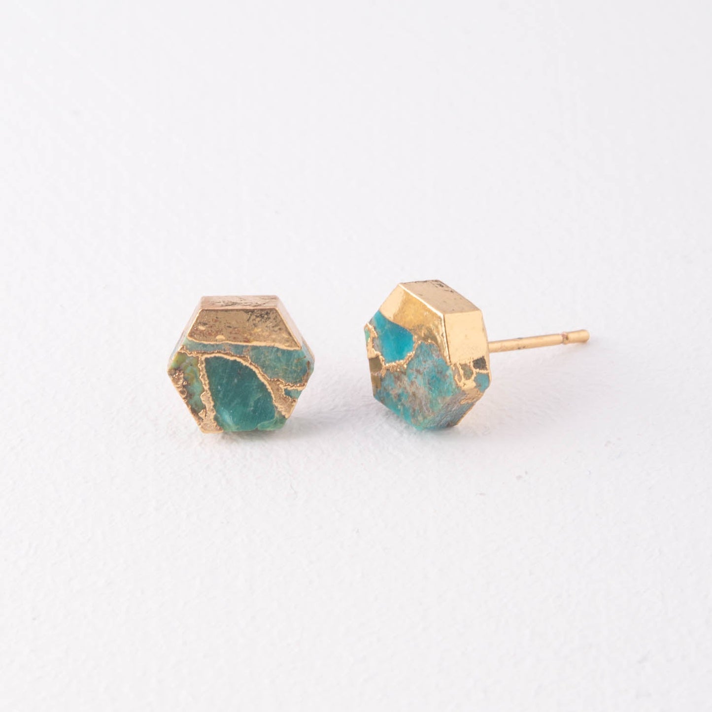 A pair of 14k gold-plated studs, fair trade high quality cute earrings with unique turquoise stones set against a marble background. great Chirstmas gift (Xmas gift), Mother's Day gift