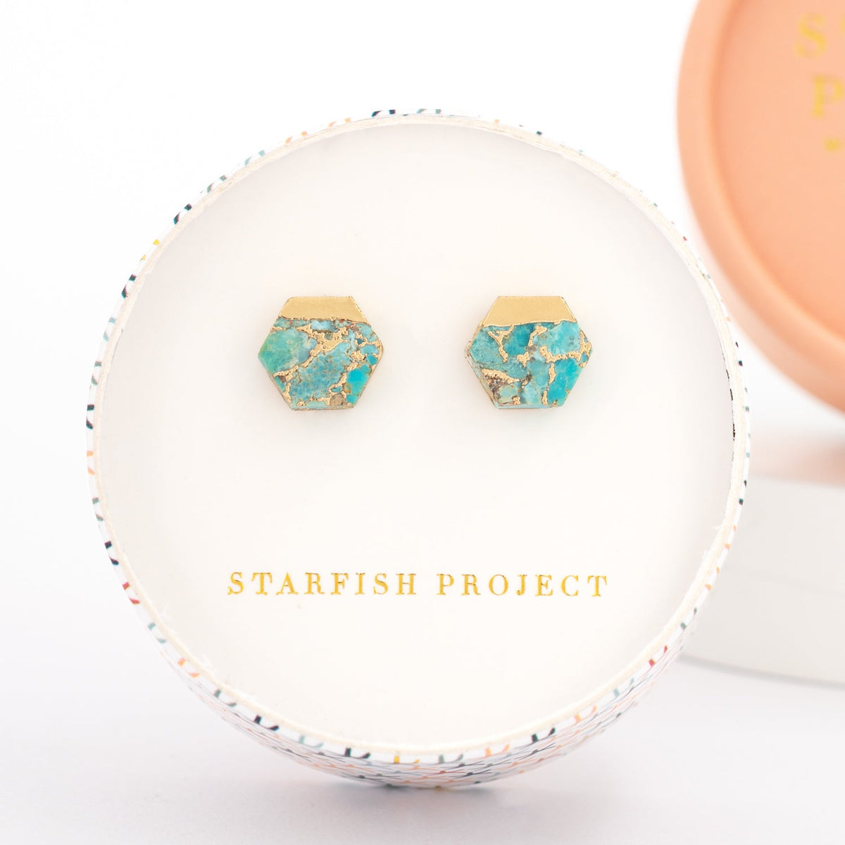turquoise and gold women's fair trade jewelry gift in a round box with the logo of Fair trade gift companies, Starfish Project