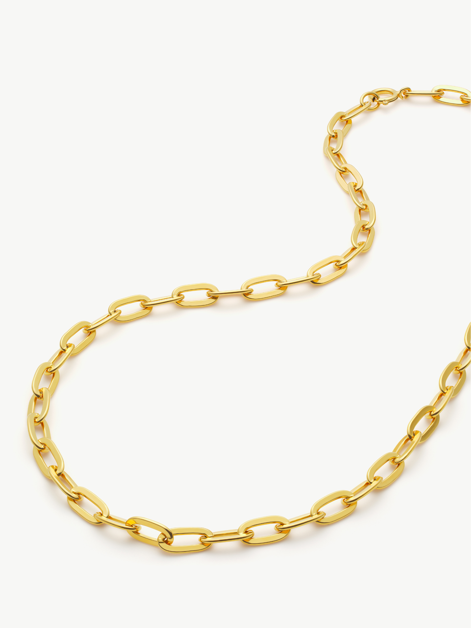 Gold chain necklace on a white background