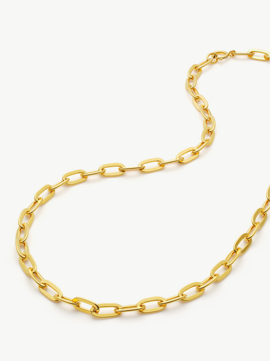 Gold chain necklace on a white background
