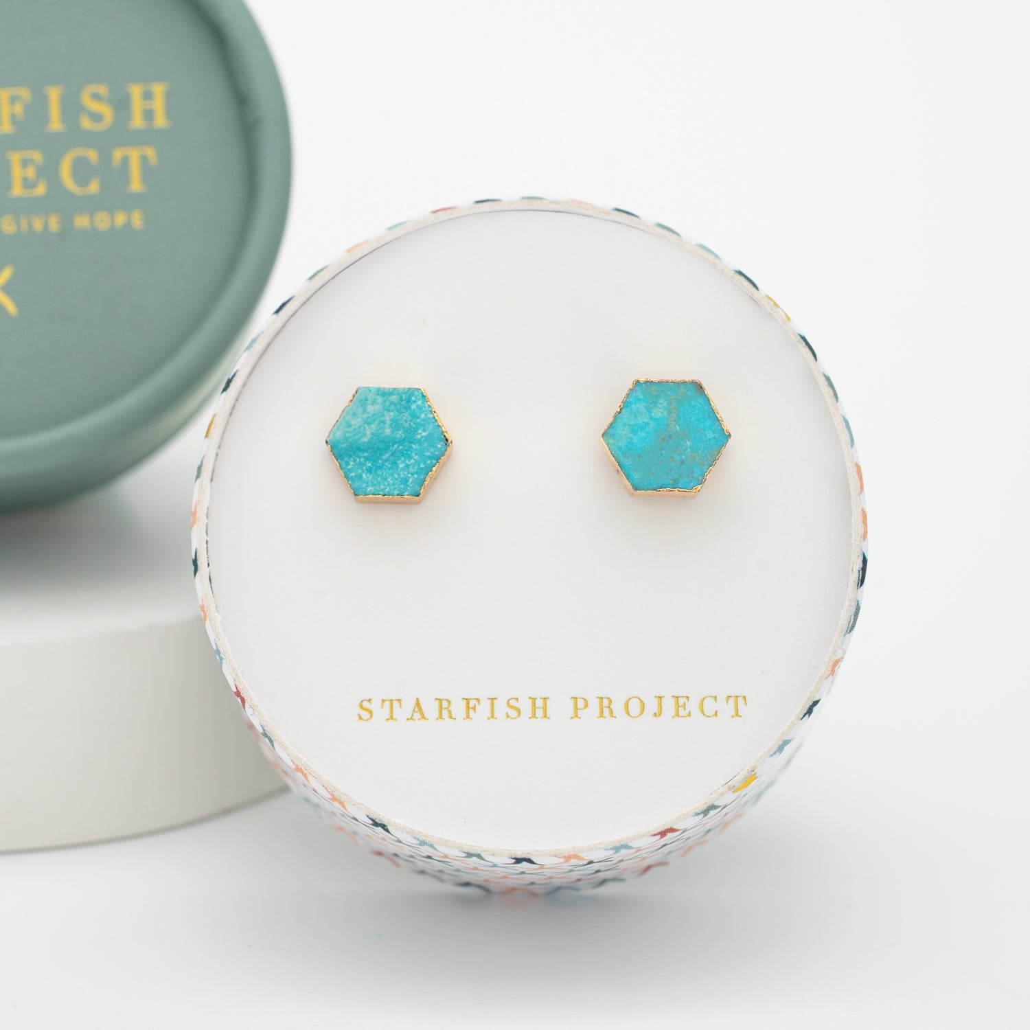 Turquoise and gold shaded earrings in a colorful box with company name, Starfish Project, jewelry business, beautiful fashion jewelry, Christmas gifts