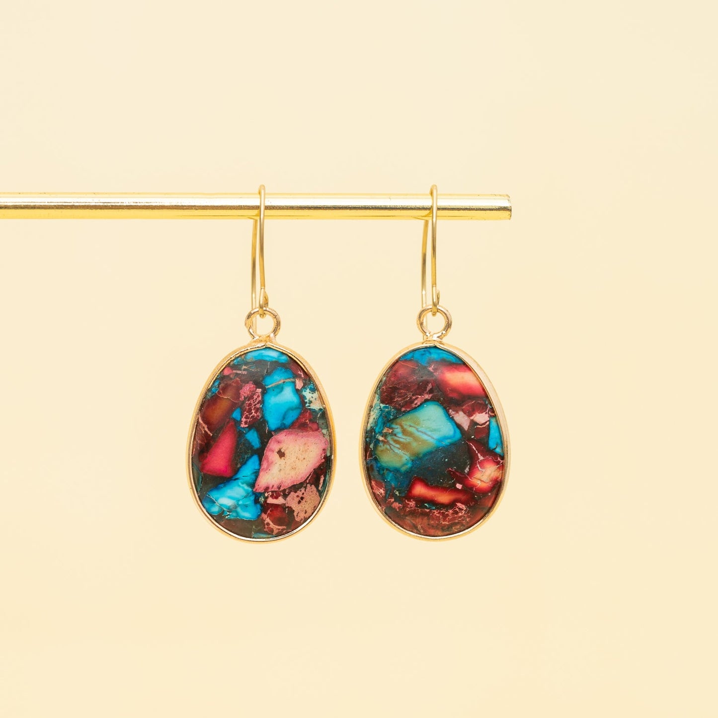 Beautiful gold, blue, and red earrings,  14k gold plated stainless steel and jasper earrings hanging from gold stand, popular jewelry brand, women's artisan jewelry