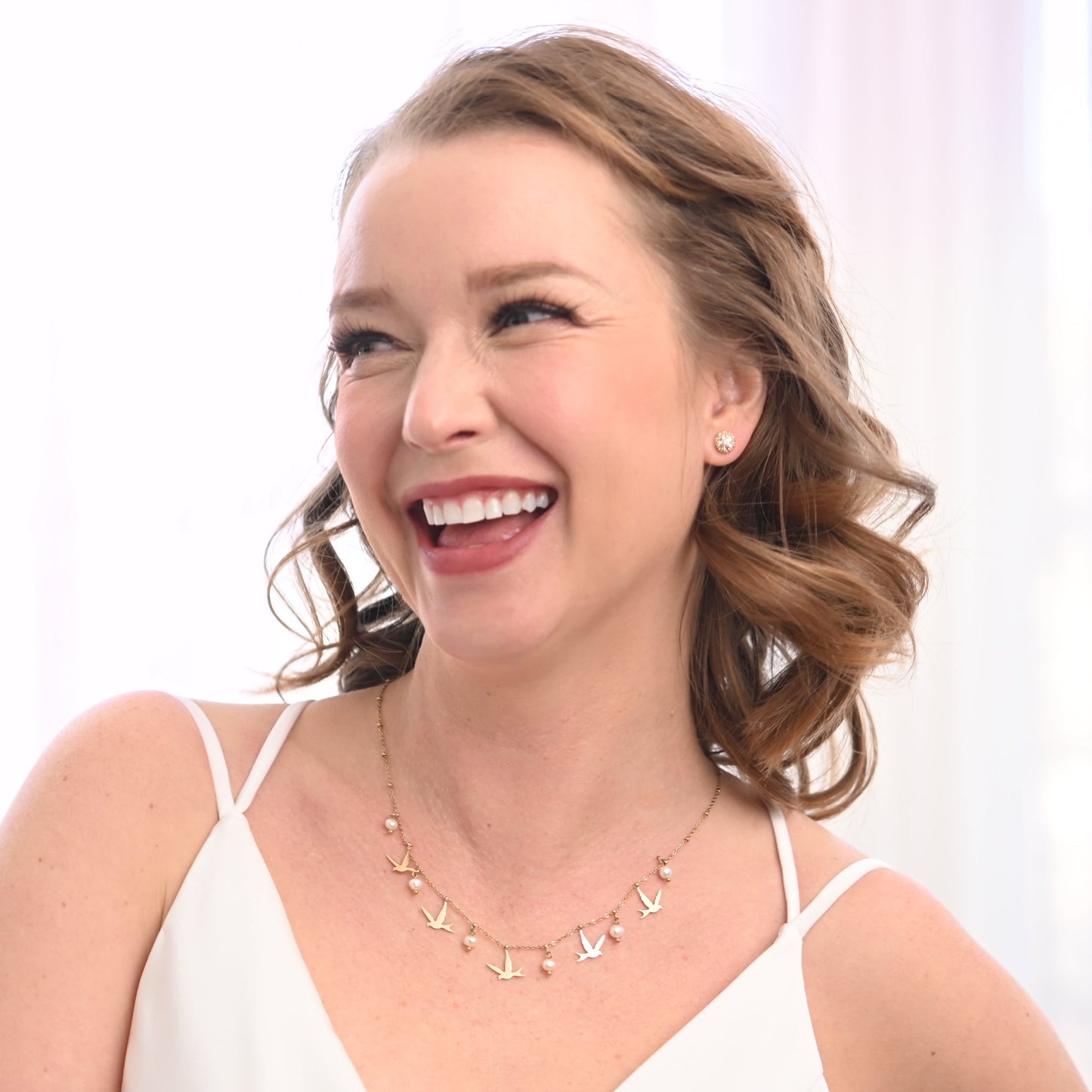 A bride wearing cute gold and pearl necklace, gold wedding necklaces, Macy's jewelry, high end jewelry brands