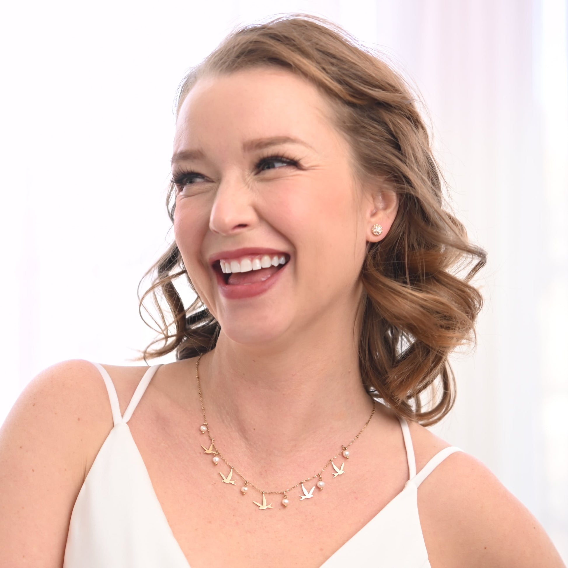 A bride wearing cute gold and pearl necklace, gold wedding necklaces, Macy's jewelry, high end jewelry brands