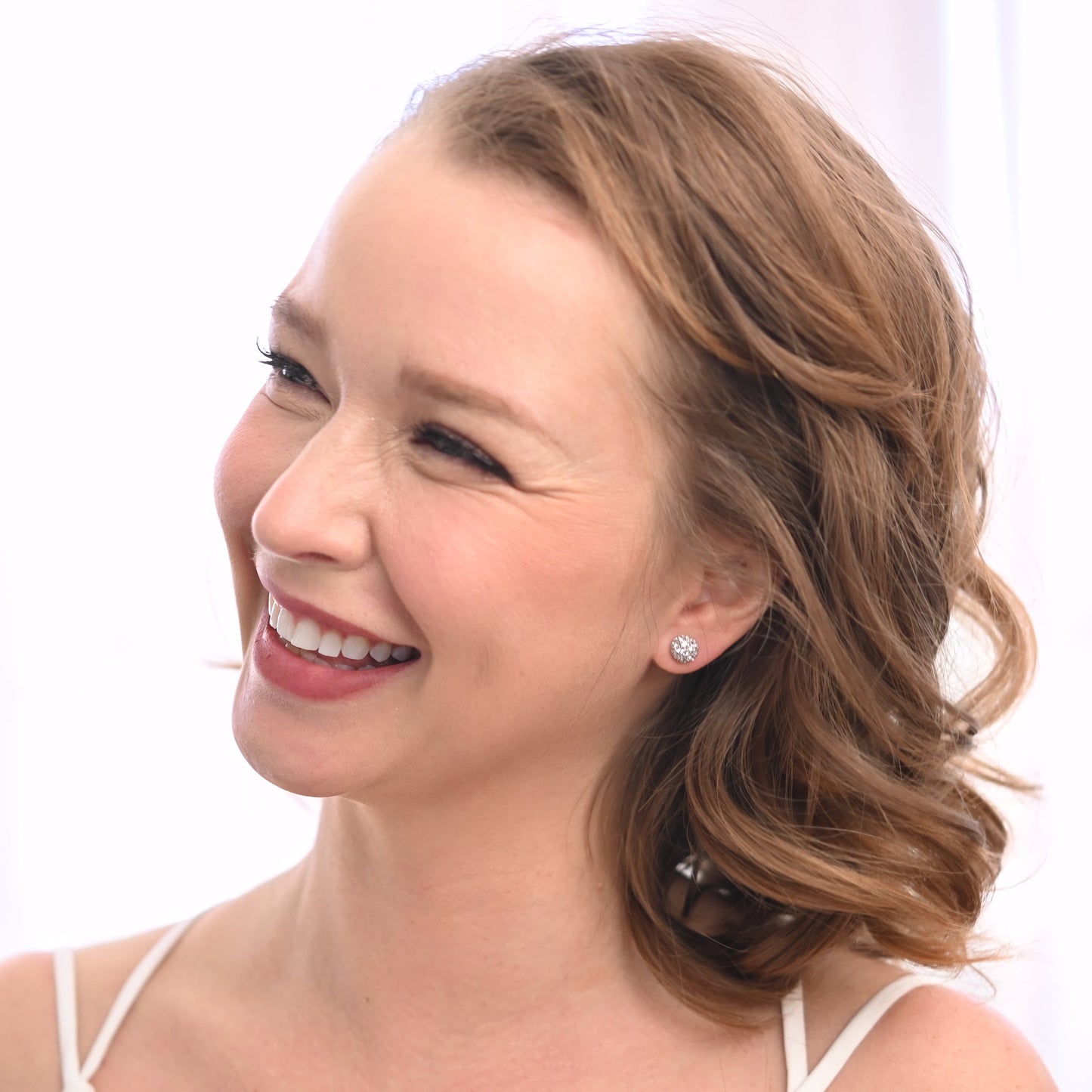 A bride wearing stunning silver studs, silver zircon earrings, freedom company business, gifting websites, jewelry gifts for women