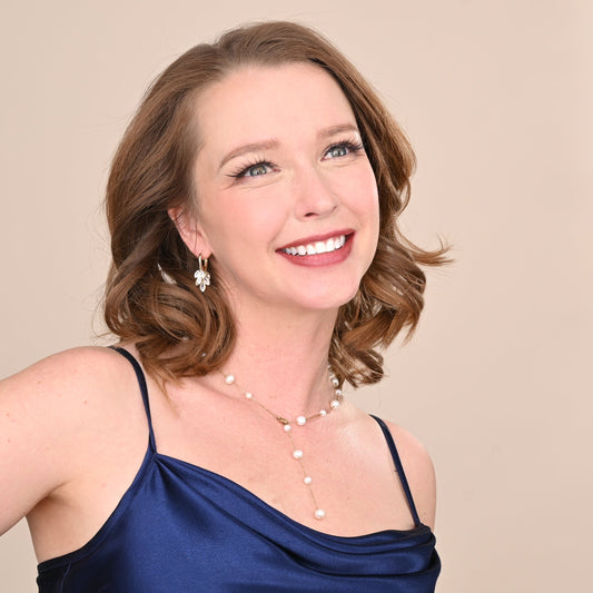 Woman modeling beautiful gold necklace and earrings, wedding day jewelry, golds, gold jewelry for brides, jewelry brands like pandora