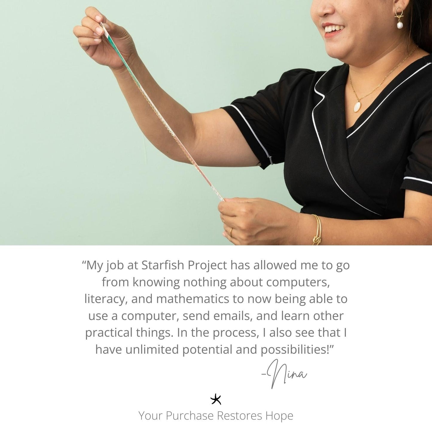 Woman smiling while wearing gold necklace with gold chain, a gold bracelet, and gold earrings with a pearl pendant, women's fair trade artisan jewelry, symbolism of hope, Starfish Project, jewelry website