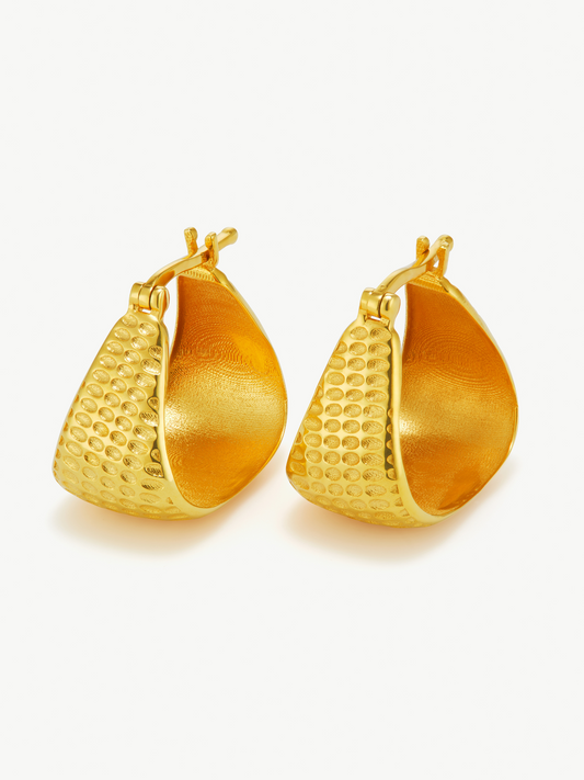 Pair of gold hoop earrings on a white background