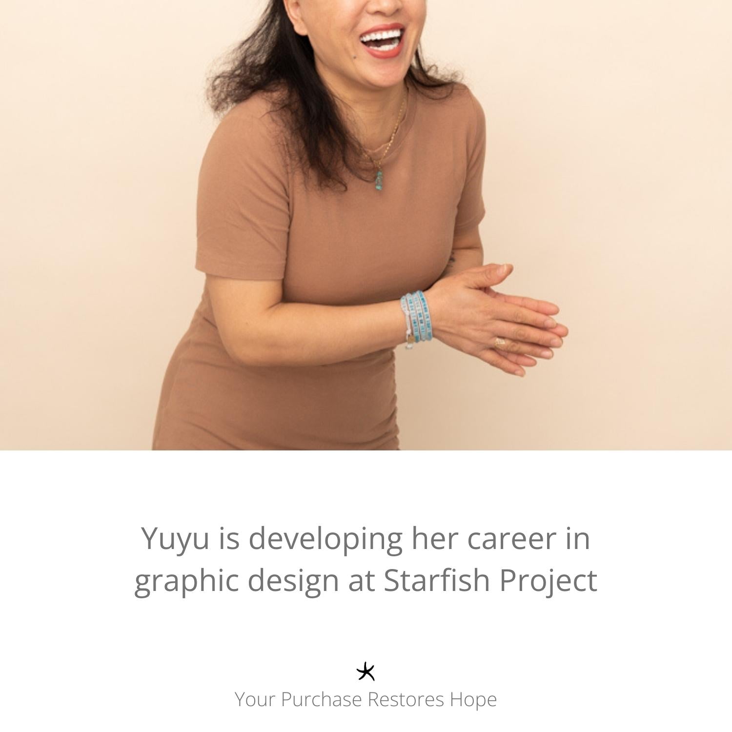 Photo of woman clapping and wearing high quality jewelry, women's artisan jewelry, jewelry company, freedom organization