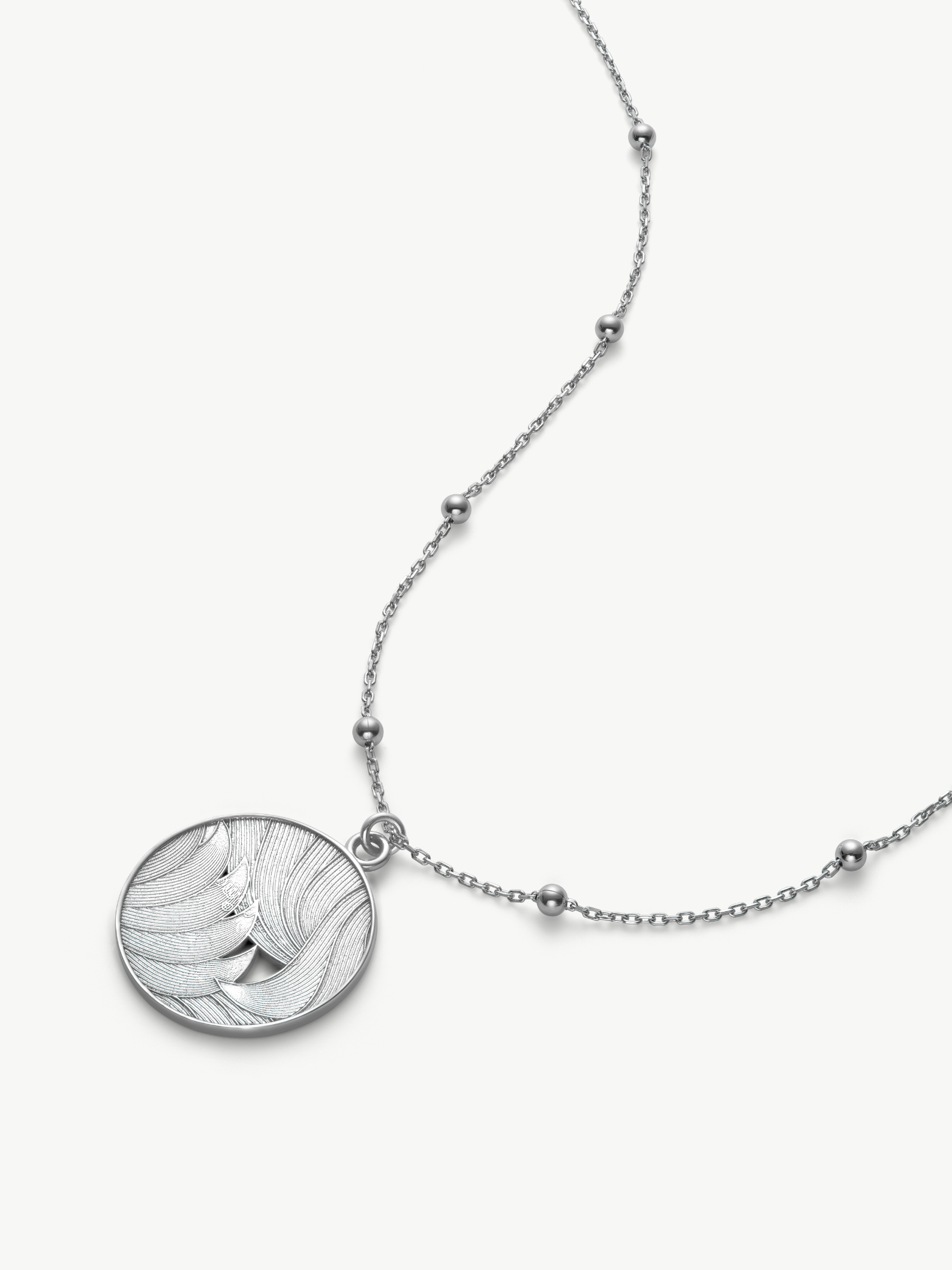 Silver medallion necklace with a satellite chain on a white background