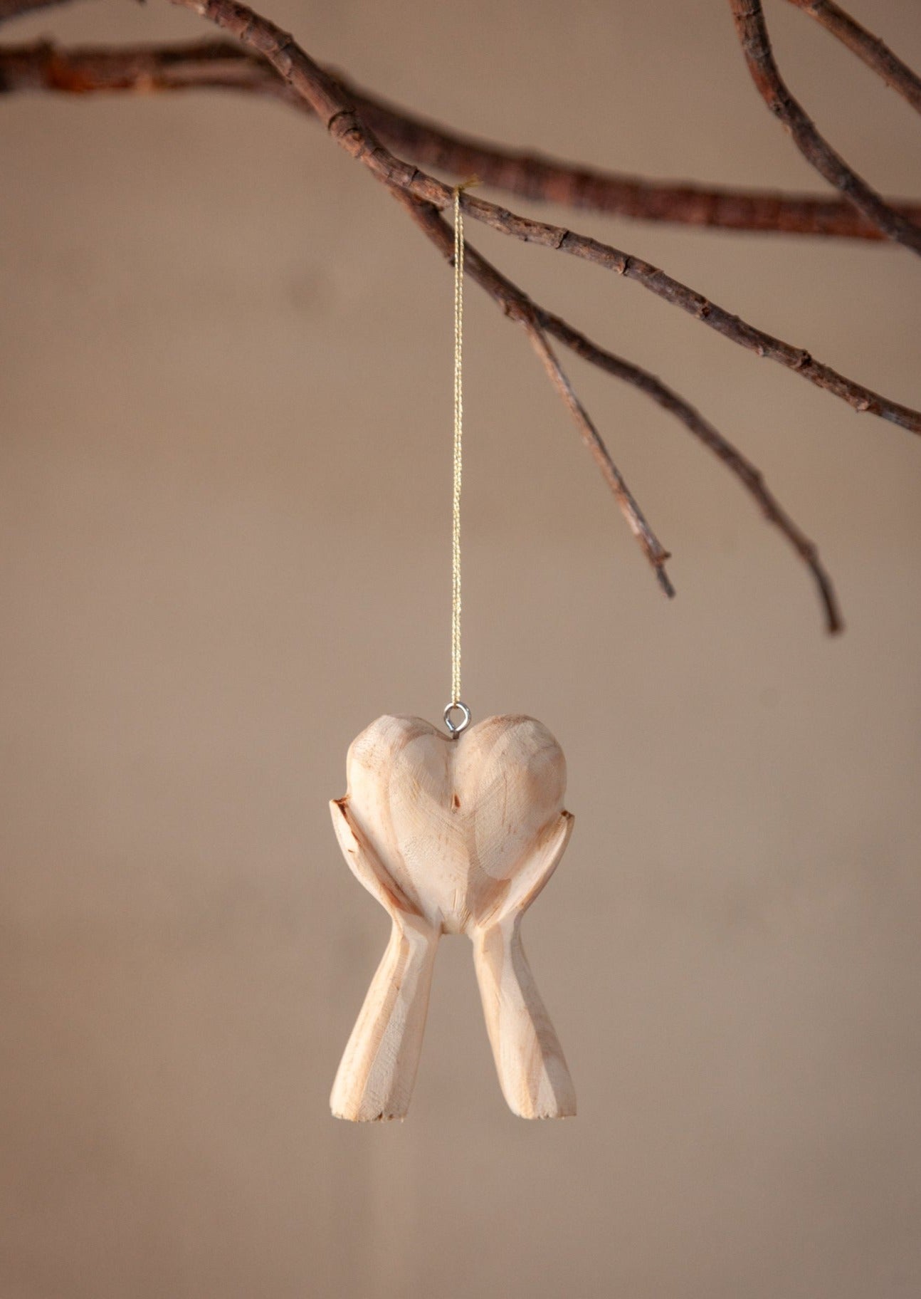 Hands Holding Heart Ornament