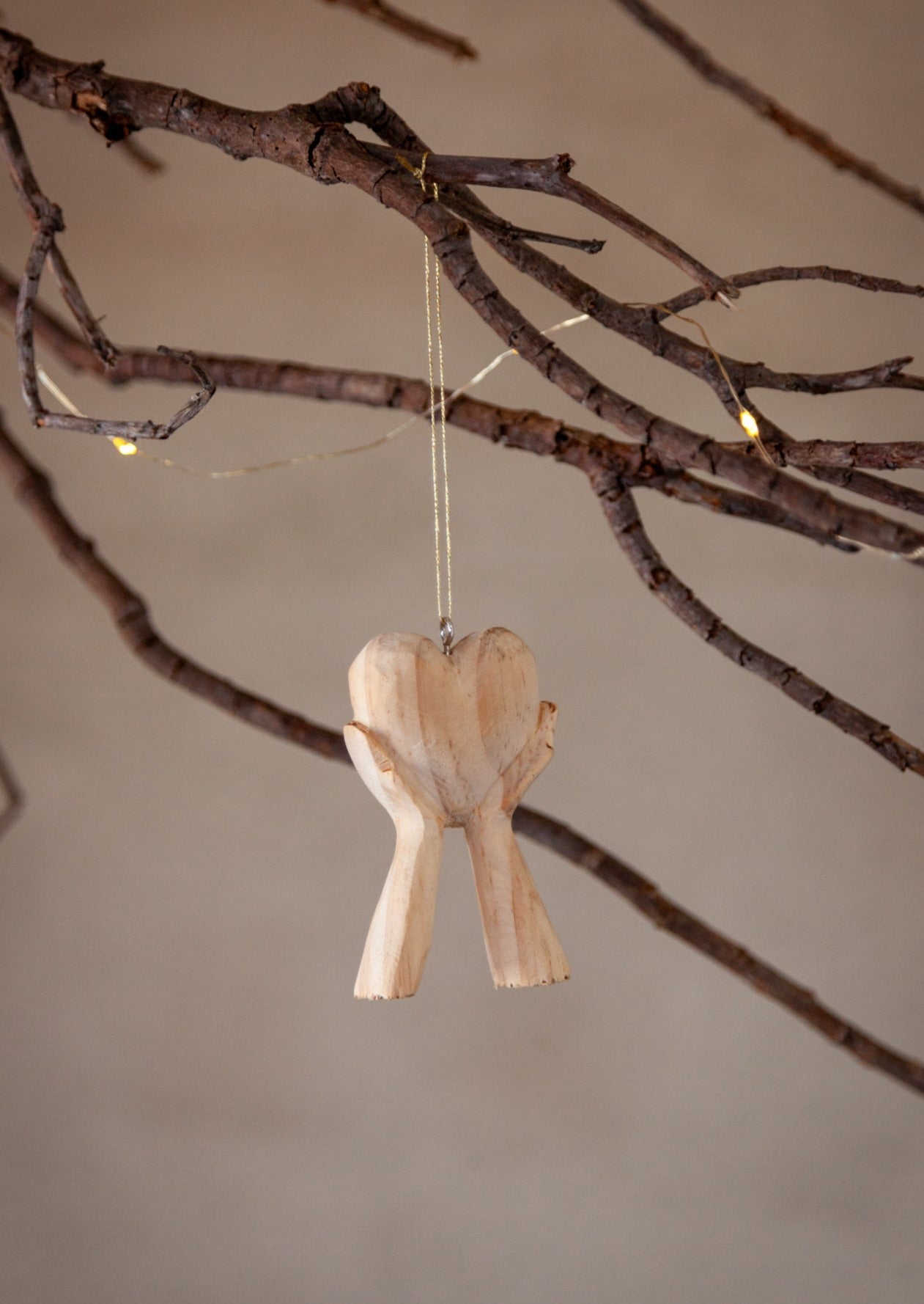 Hands Holding Heart Ornament