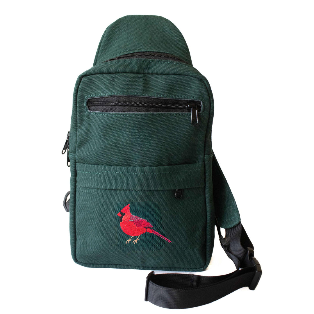 Cardinal Umoja canvas sling bag in forest green #color_forest-green
