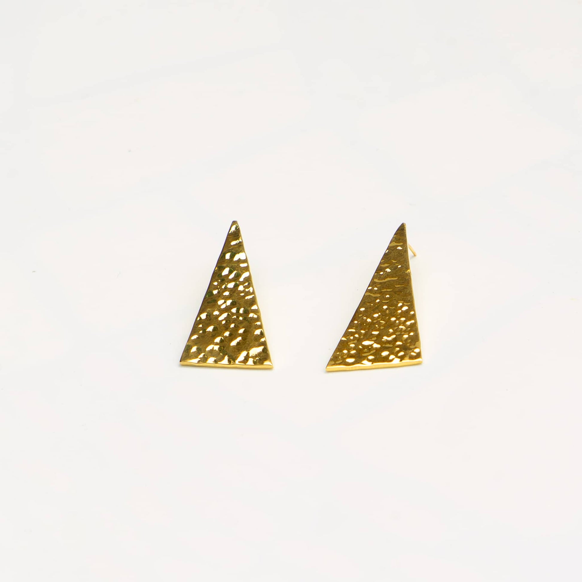 Amali hammered triangle drop stud brass earrings flat lay — Ecodunia