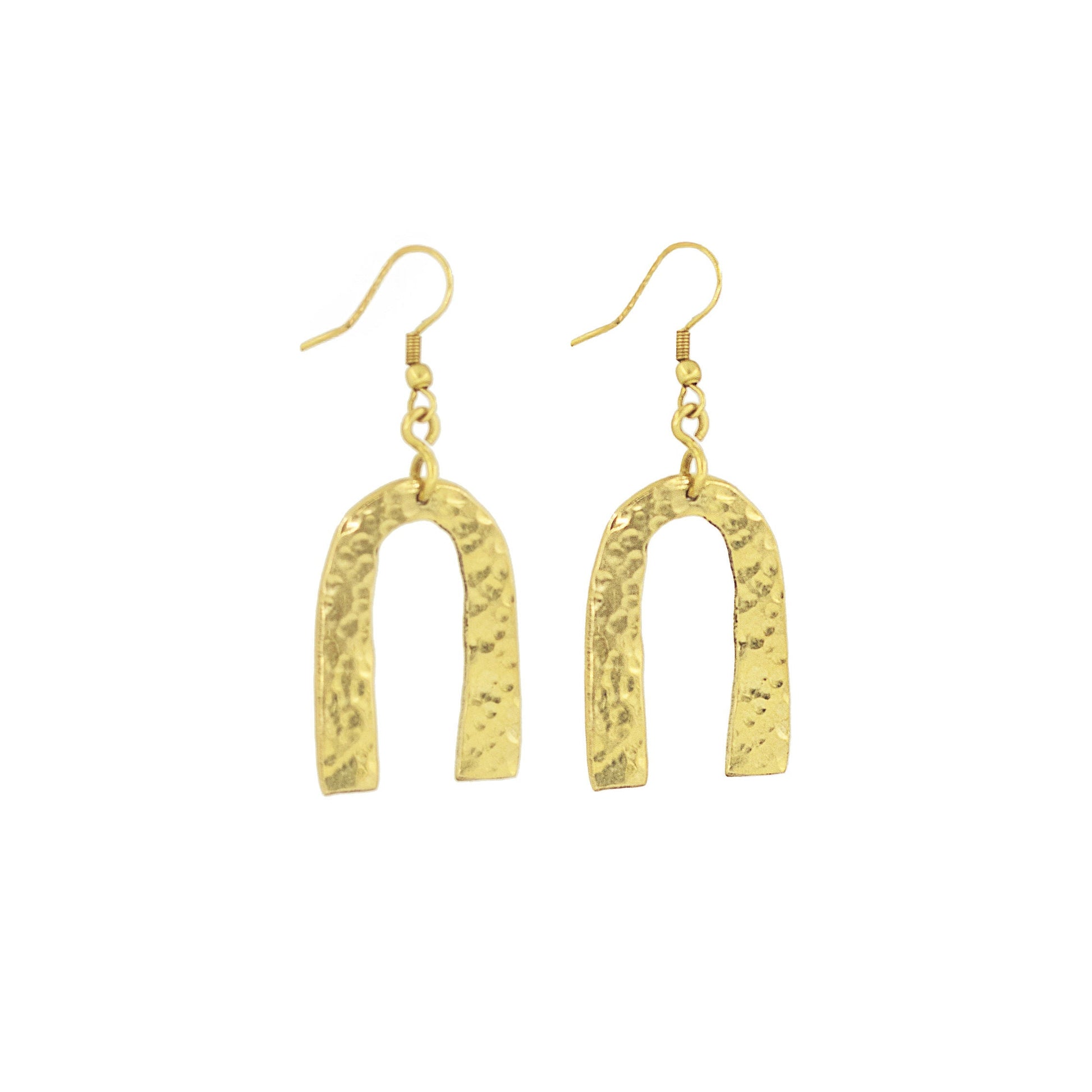 Bundi open arch brass statement earrings flat lay — Ecodunia