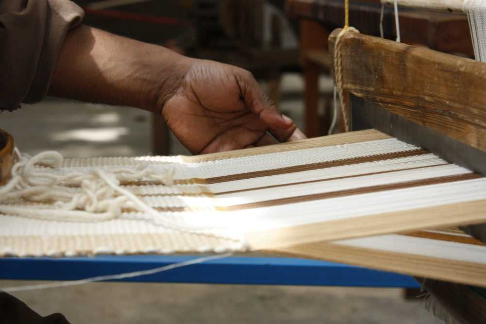 Artisan weaving gonder runner on a traditional loom 