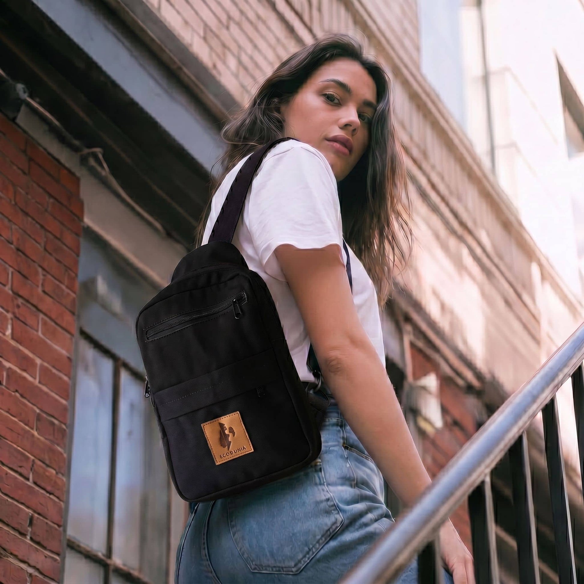 Umoja black canvas crossbody sling bag for men and women #color_black
