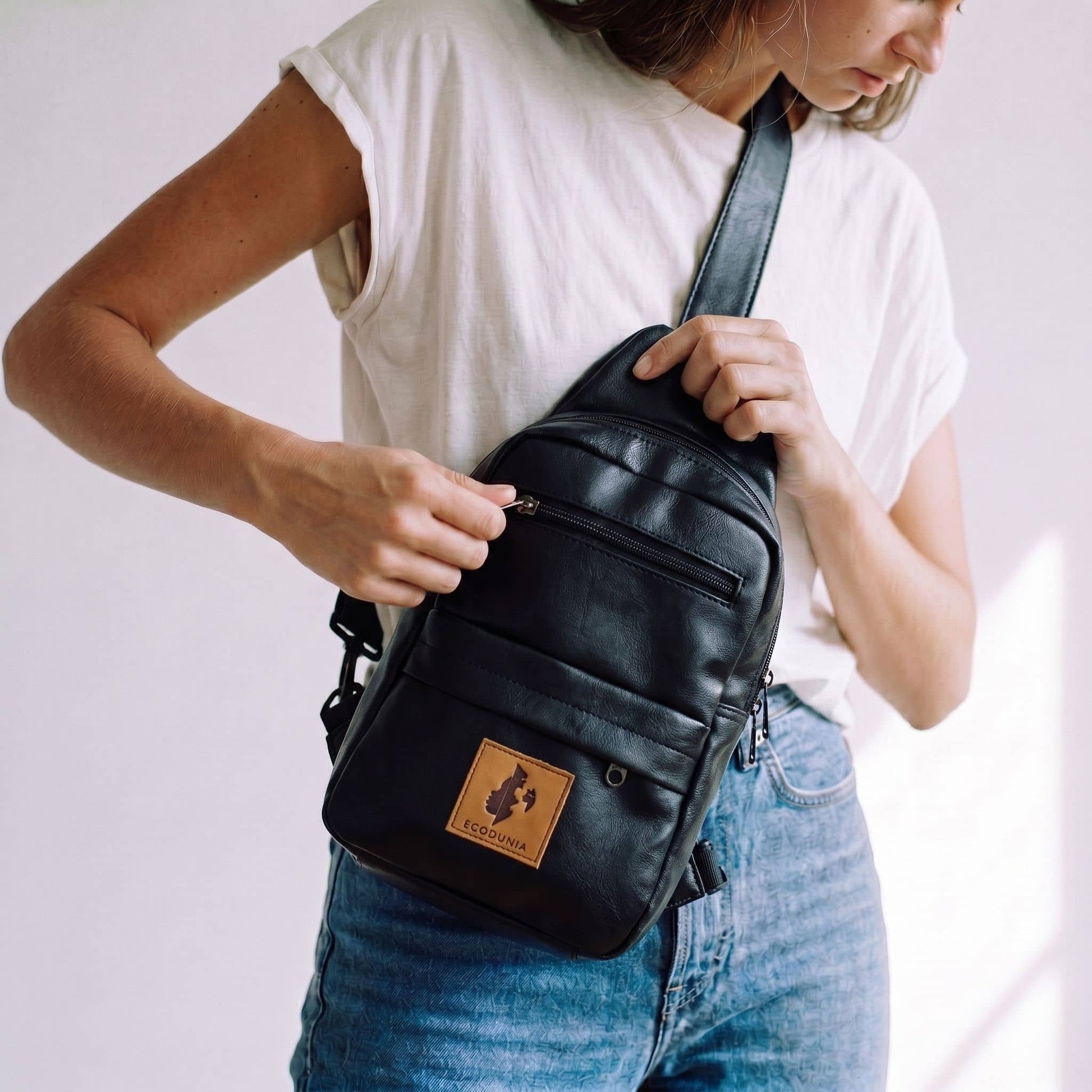 Umoja black vegan leather large crossbody sling bag #color_black