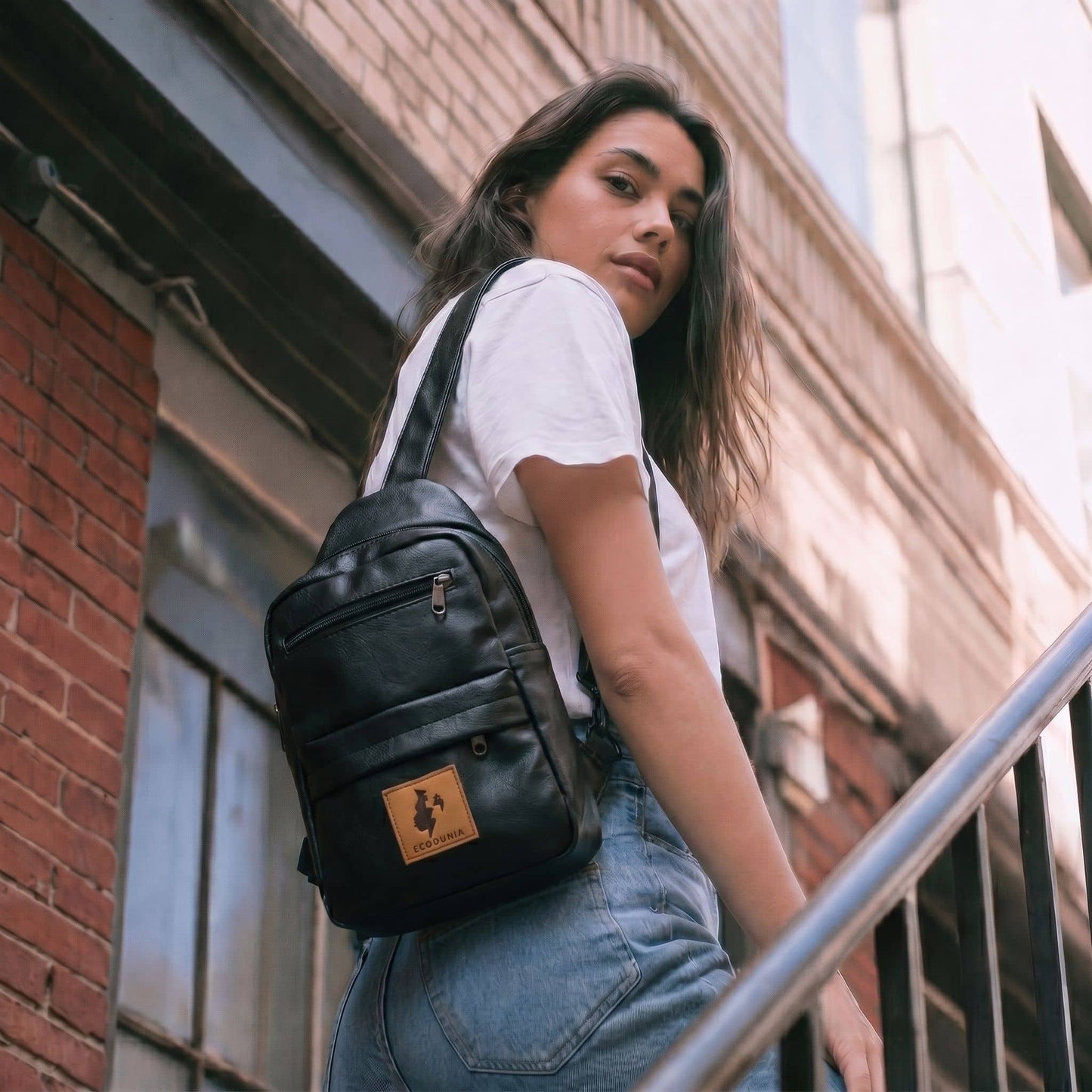 Umoja black vegan leather large crossbody sling bag #color_black