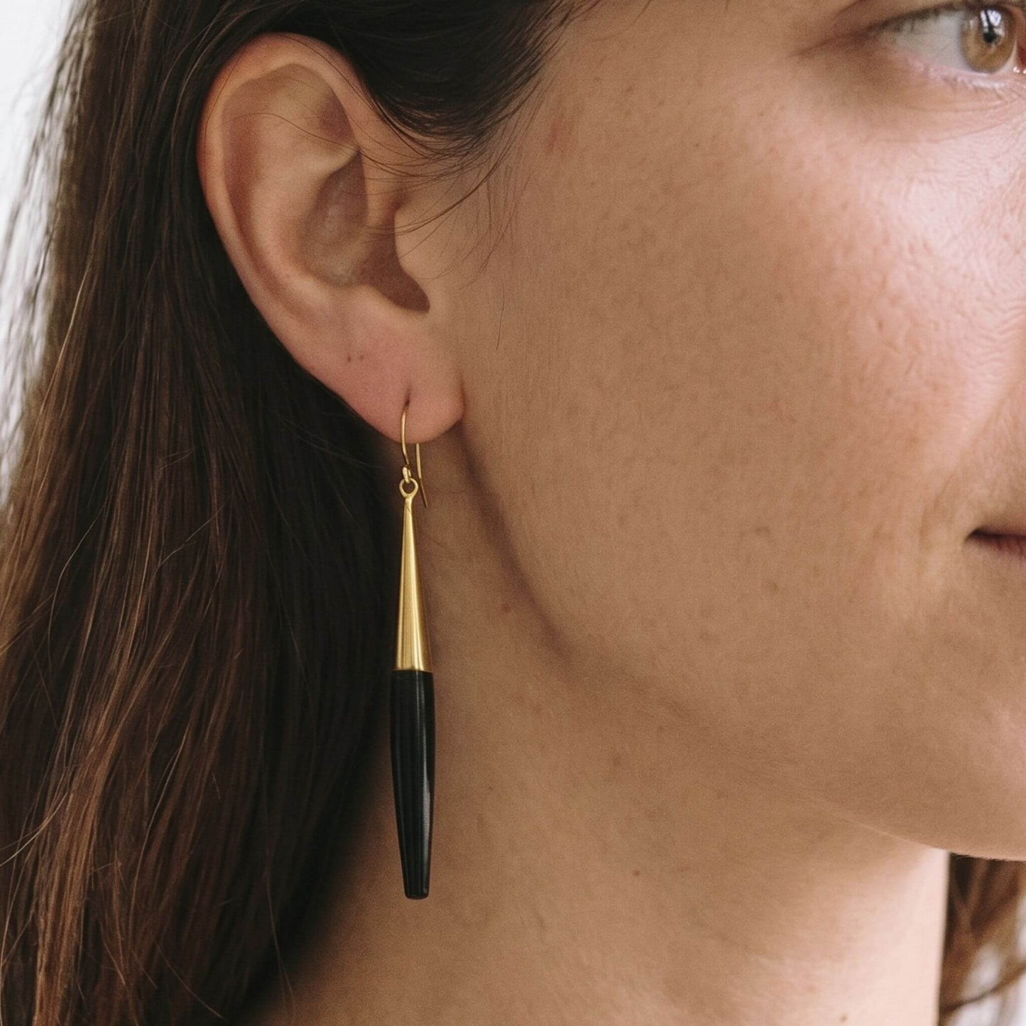 Luna brass and white horn spike drop earrings flat lay — Ecodunia #color_black