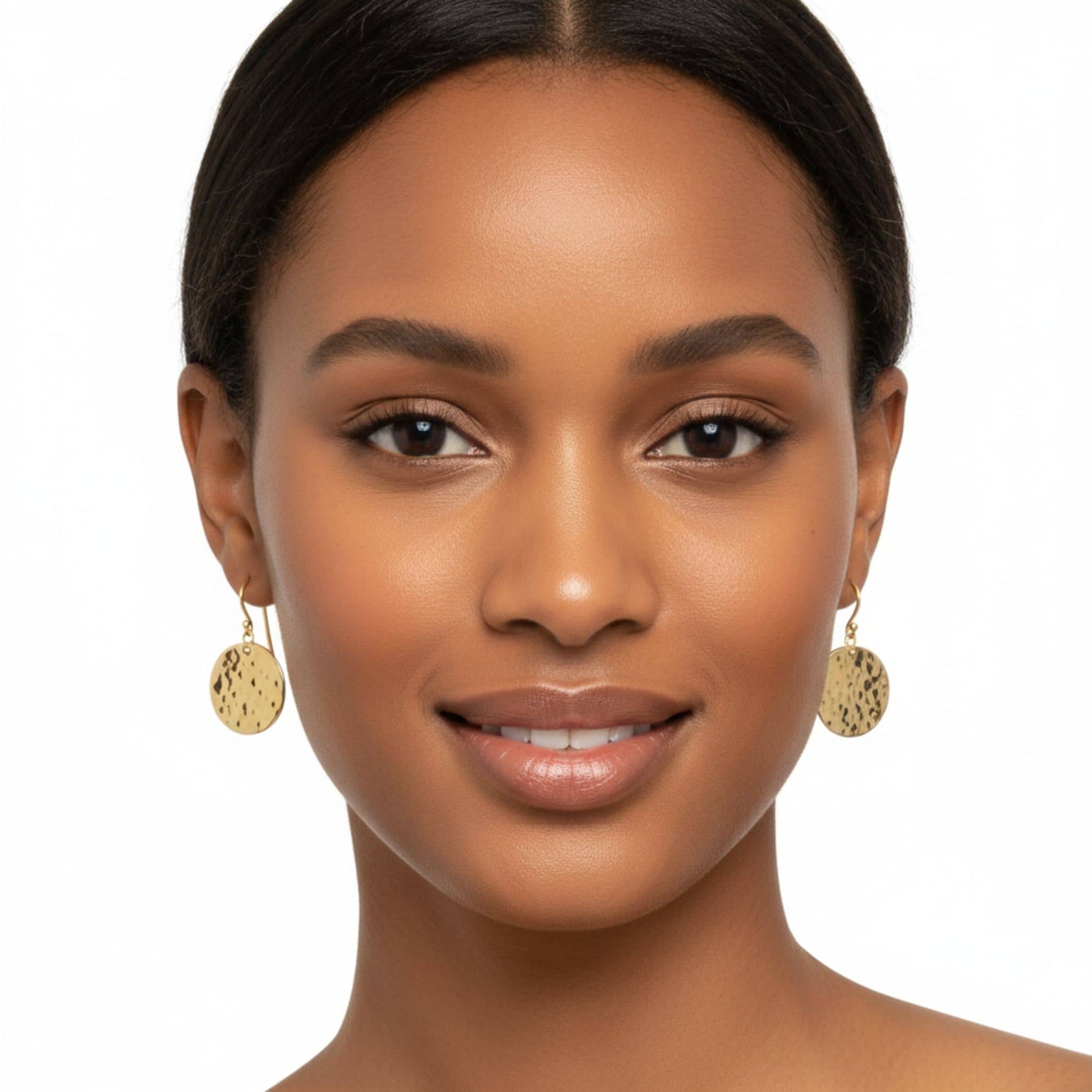 Njiwa brass disc dangle earrings detail showing hammered surface
