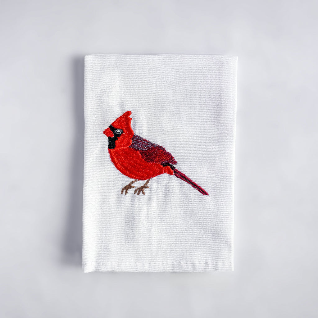 Cardinal embroidered cotton cloth napkin flat lay on white surface — Ecodunia