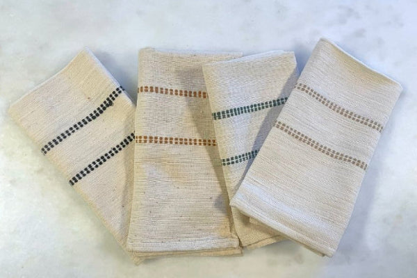Chamo napkins in almond, bronze, black and cedar