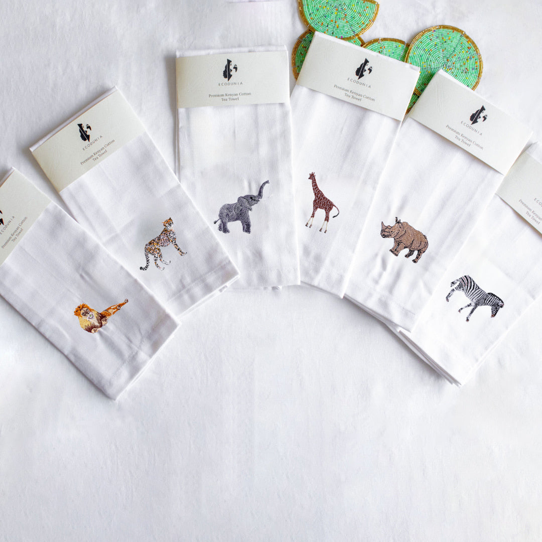 Cotton kitchen tea towel with hand-embroidered African animal design