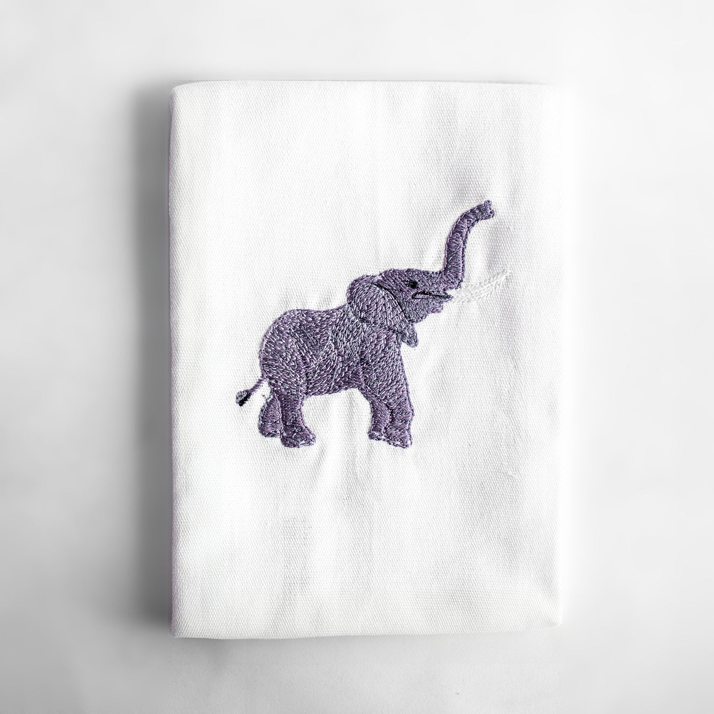 Baby Elephant embroidered cotton dinner napkin flat lay