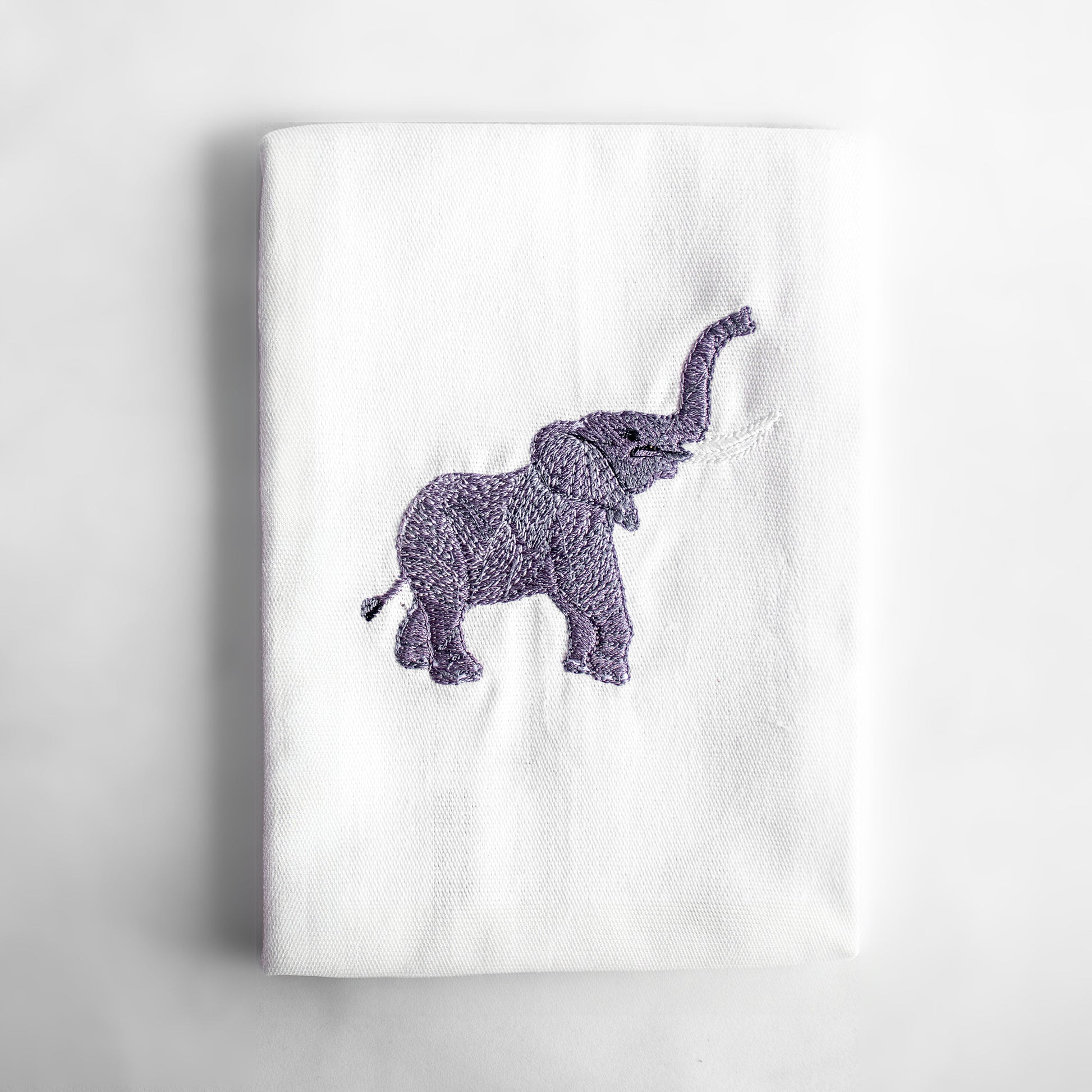 Baby Elephant embroidered cotton dinner napkin flat lay