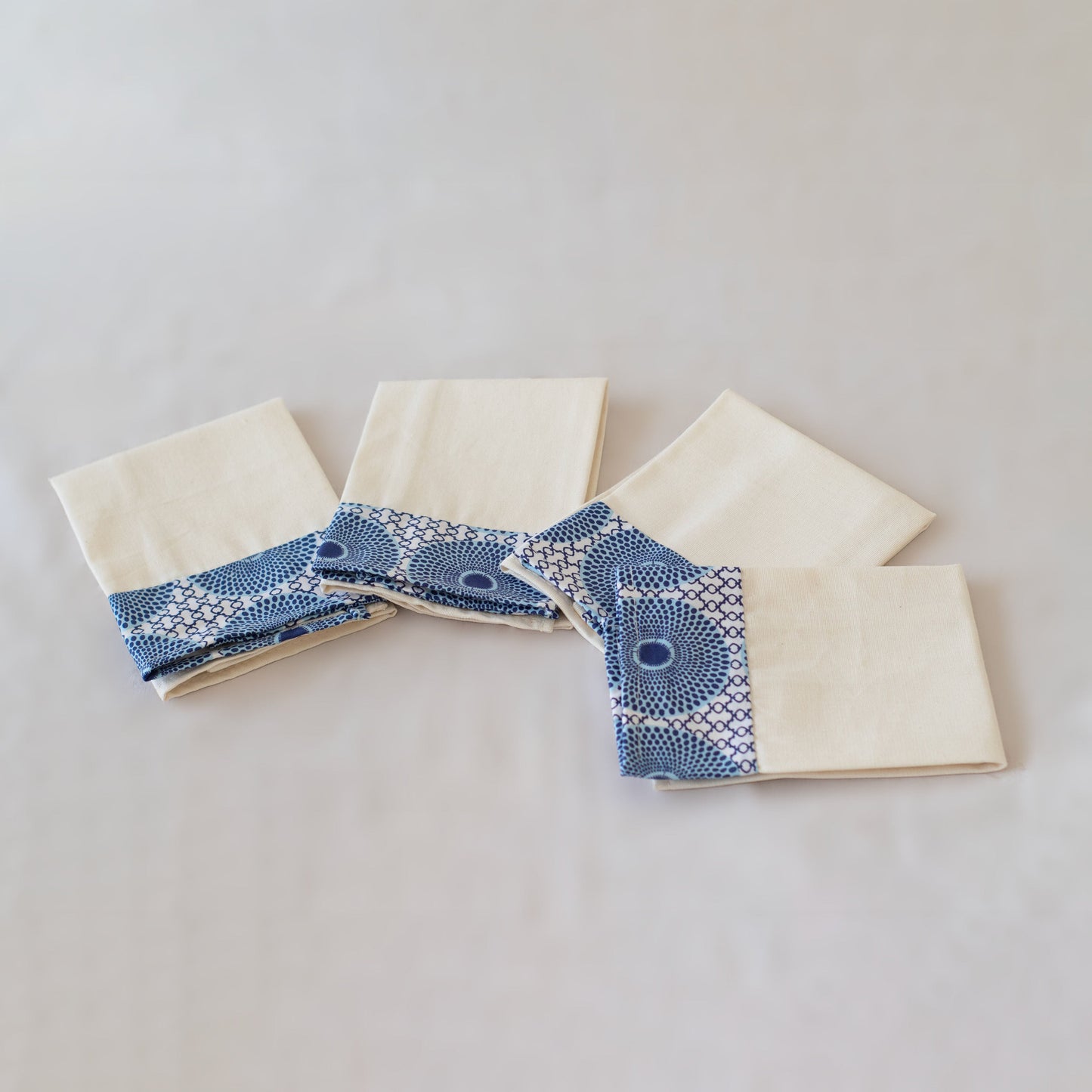 Natural cotton cloth napkins with vibrant kitenge fabric trim close-up