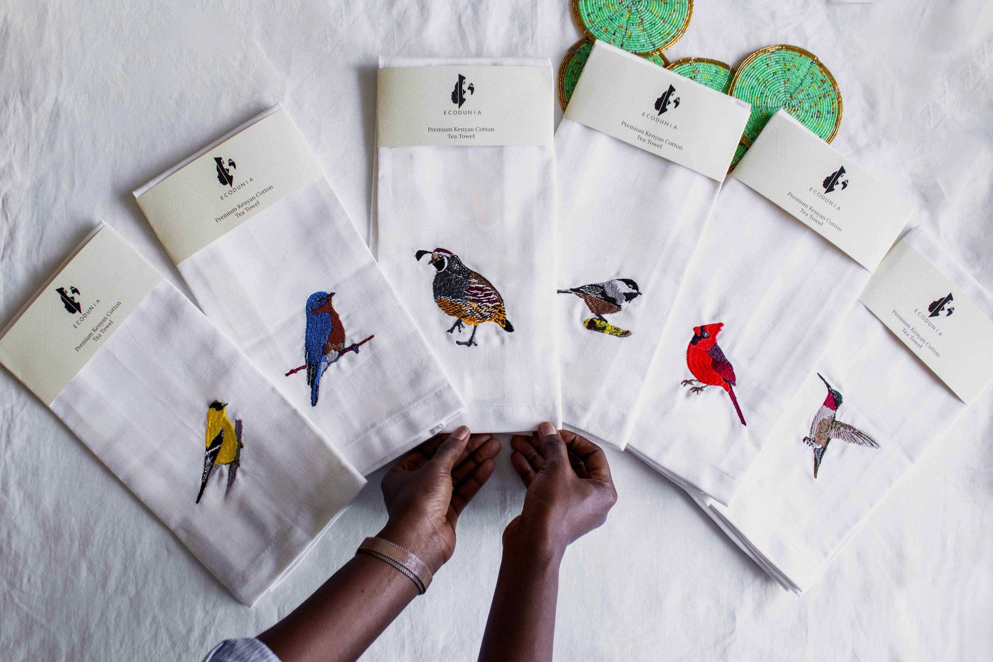 Hummingbird embroidered cotton tea towel flat lay on white surface — Ecodunia #birds_humming-bird
