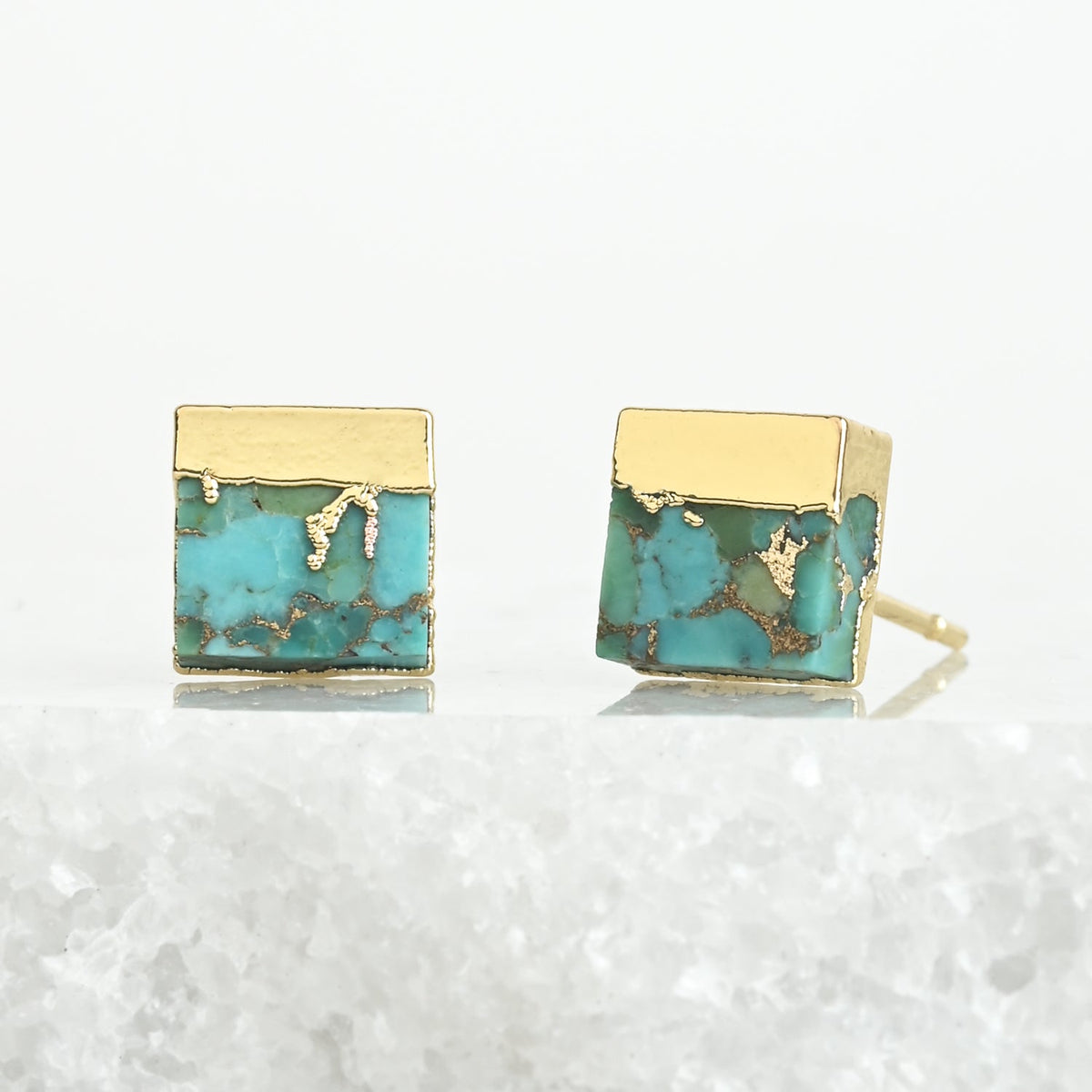 A pair of 14k gold-plated studs, fair trade high quality cute earrings with unique turquoise stones set against a marble background. great Christmas present (Xmas gift), Mother's Day gift