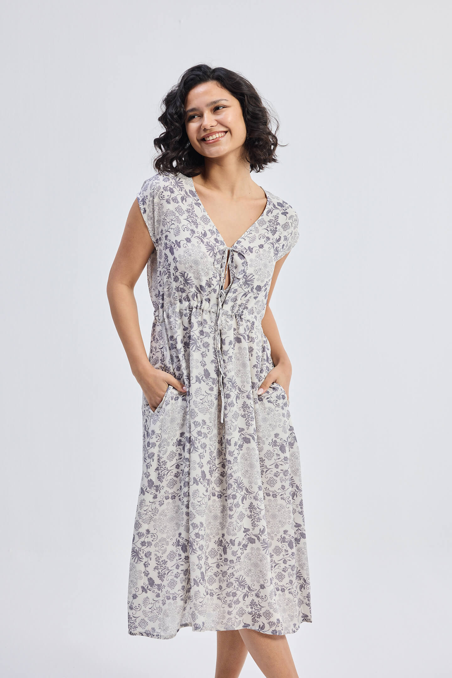 Deep V-neck Gathered Dress in Florals Front