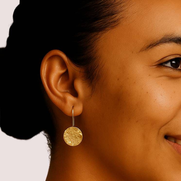 Njiwa hammered disc brass drop earrings flat lay — Ecodunia