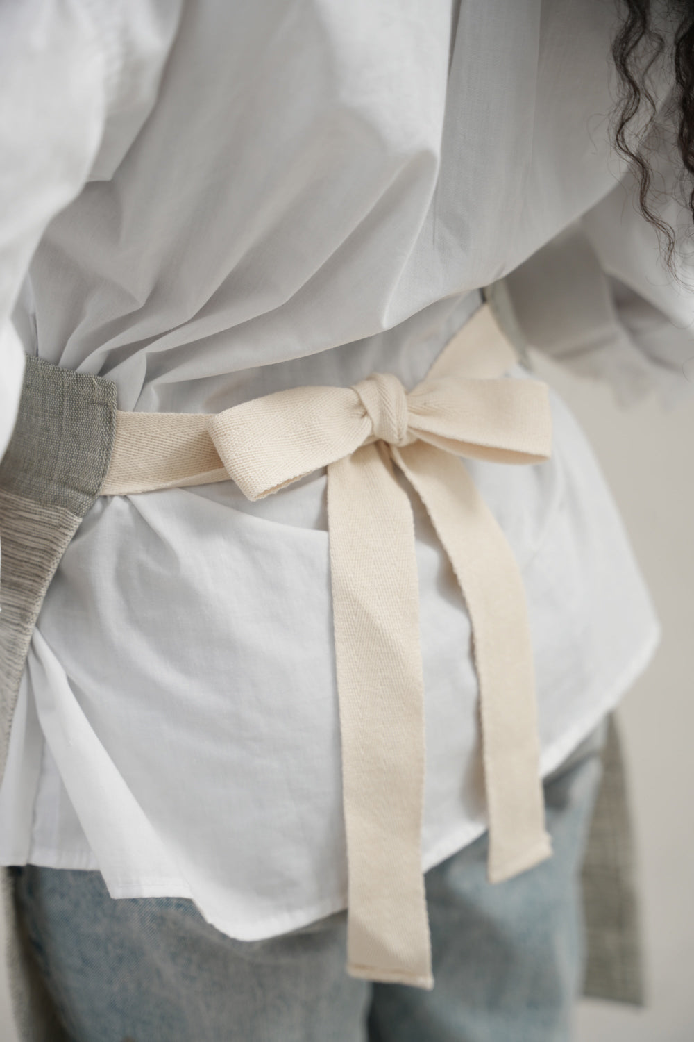 Grey Apron from the back on model 