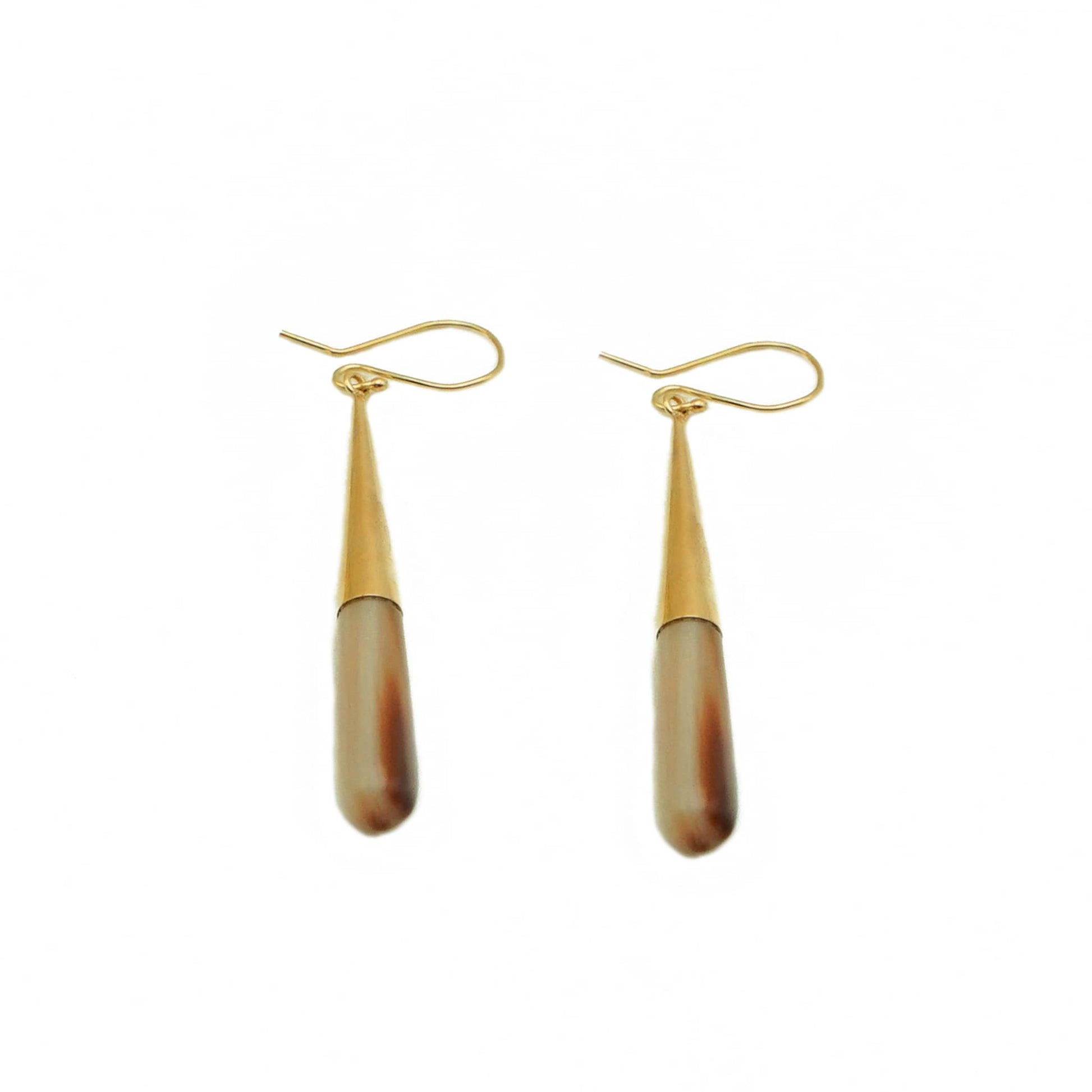 Guru brown horn drop earrings worn showing natural material
