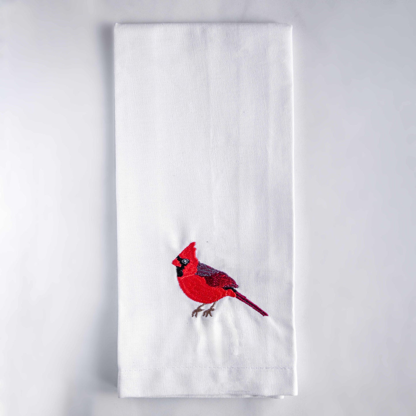 Blue Bird embroidered cotton tea towel flat lay on white surface #birds_cardinal