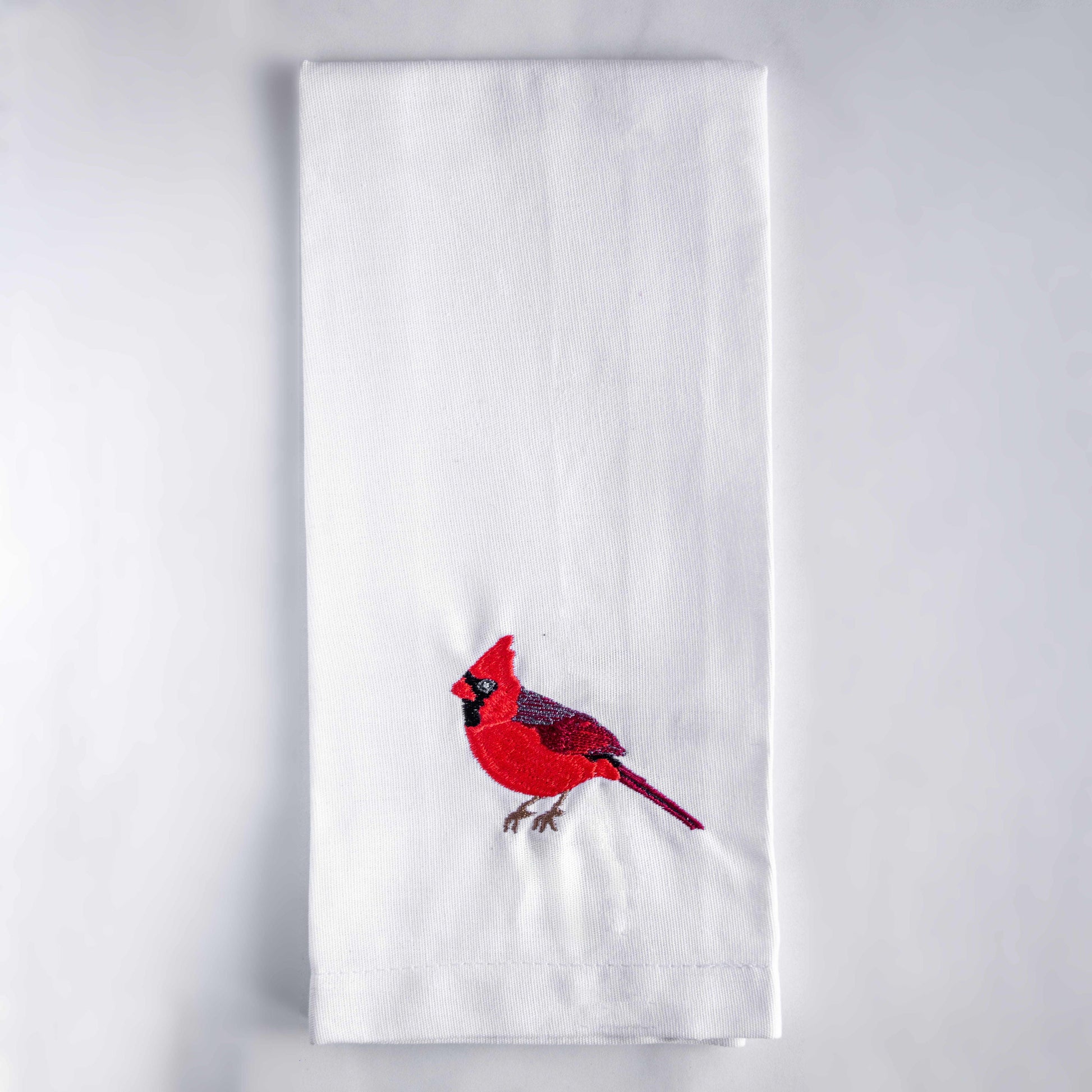 Blue Bird embroidered cotton tea towel flat lay on white surface #birds_cardinal