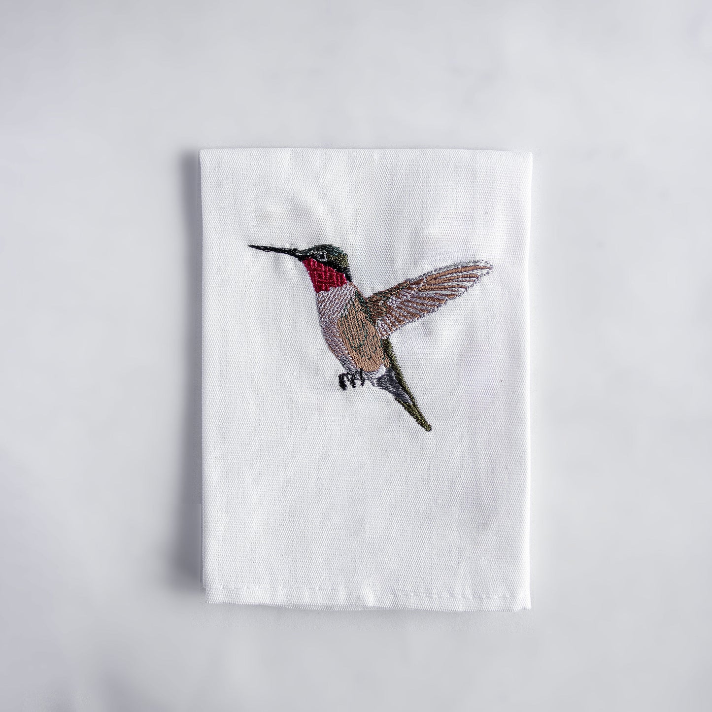Hummingbird embroidered cotton cloth napkin on white background