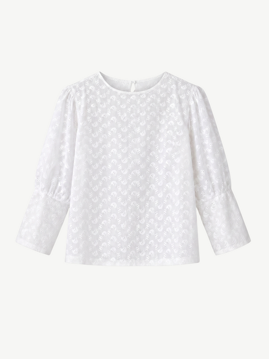 White long-sleeve top with a subtle pattern on a white background