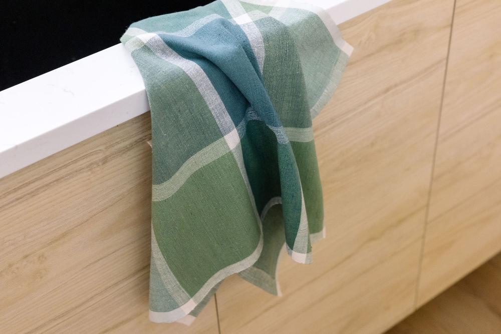 Jane  kitchen towel in flax by kitchen sink